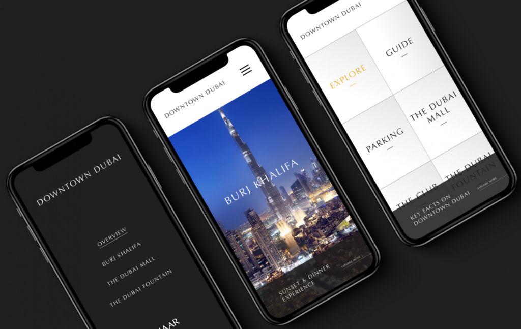 Three smartphones displaying different app screens, including a city skyline view and interface menus, set against a dark background.