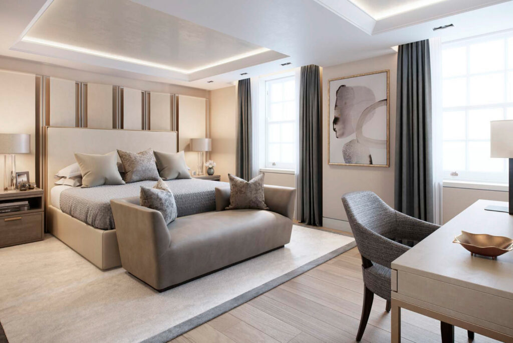 Sophisticated bedroom with a neutral color palette, featuring a large upholstered bed, soft lighting, floor-to-ceiling curtains, and a desk by the window.