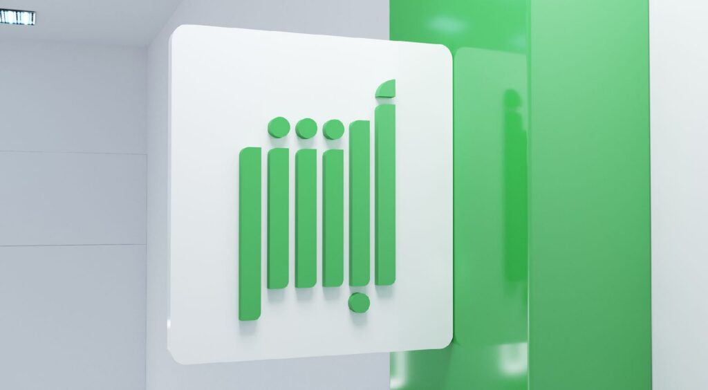 Minimalist green Absher logo mounted on a clean white wall, featuring stylized vertical shapes.